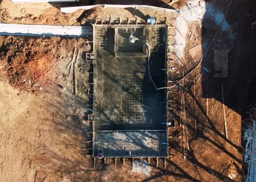 Overhead view of a gunite pool shell after concrete application