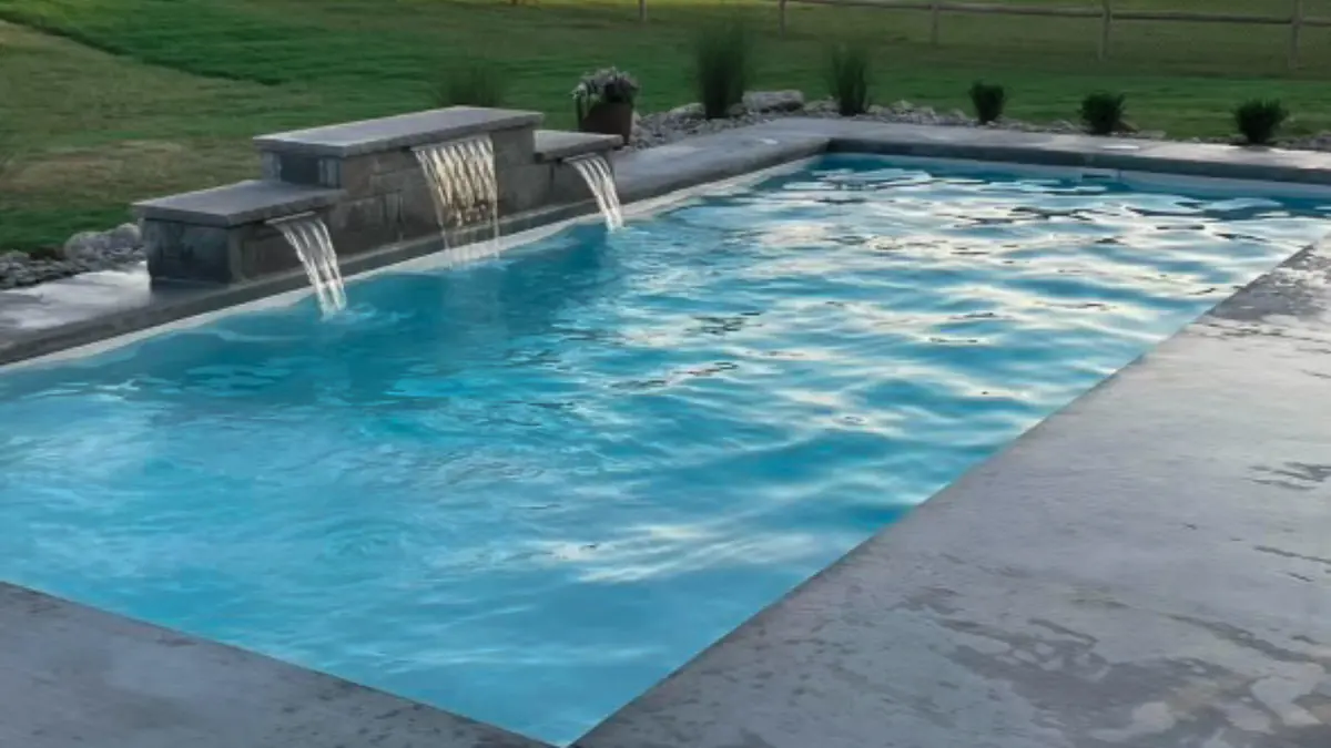 Rectangular gunite pool with sheer descent waterfalls built in Oklahoma