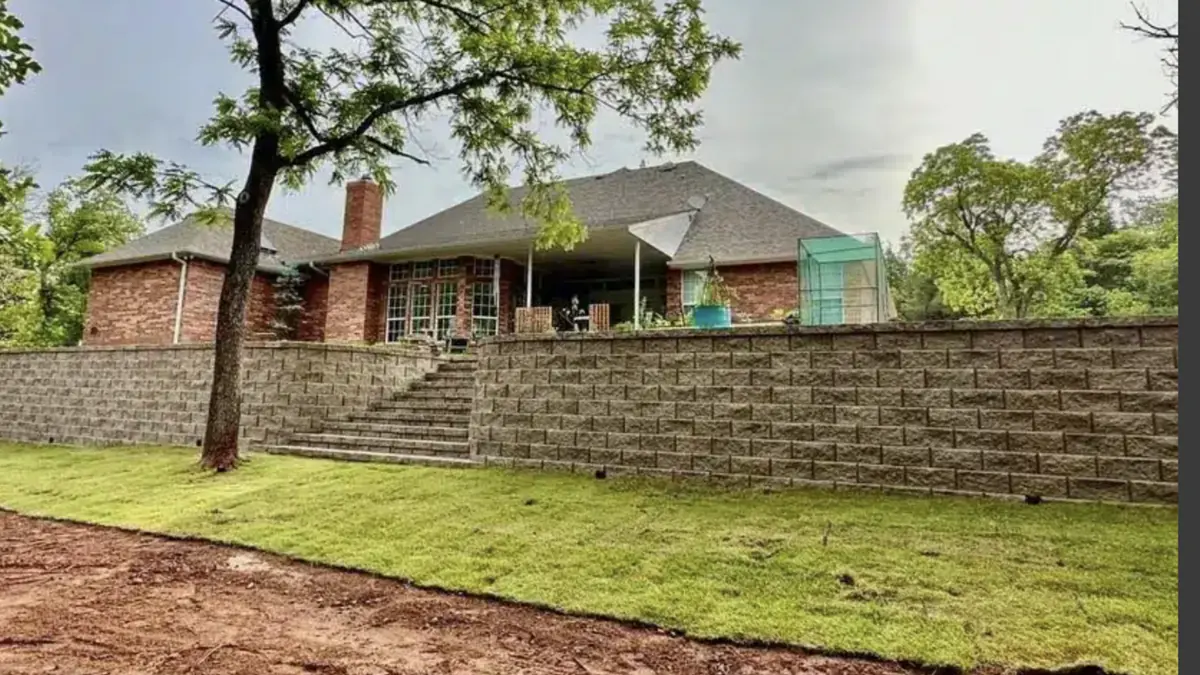 Retaining wall and fresh sod installed by Imperial Landscape Works
